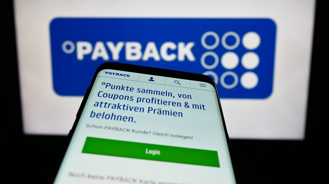 Stuttgart, Germany - 09-01-2023: Mobile phone with webpage of German loyalty management company Payback GmbH on screen in front of logo. Focus on top-left of phone display.