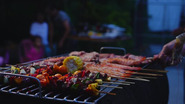 Home Garden BBQ Party, Wine Glasses Clink in Family Toast, enjoying harvest time together outside at front of house, grandfather and grandfather asian people, man and woman