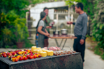 BBQ Fun Party with Grandparents, Family Gathering in the Garden, Summertime with grandpa, grandma, father and mother, BBQ Grill