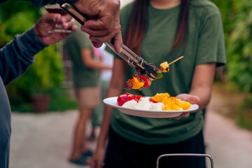 BBQ Fun Party with Grandparents, Family Gathering in the Garden, Summertime with grandpa, grandma, father and mother, BBQ Grill