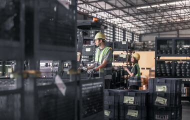 Fototapeta premium Warehouse forklift operator moves, stores merchandise, stays in touch with team, boss via radio