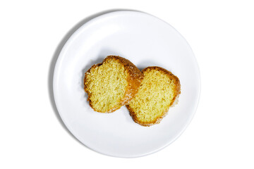 slice of delicious coconut bundt cake in white plate isolated on white background