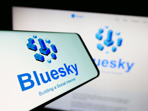 Stuttgart, Germany - 09-02-2023: Cellphone with logo of social network initiative Bluesky on screen in front of website. Focus on center-left of phone display.