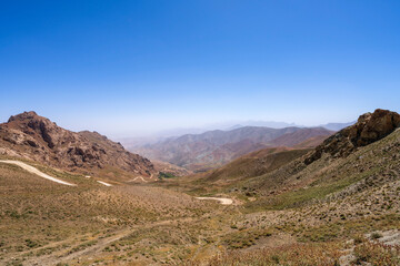 Hindu Kush in Central Afghanistan, an arid landscape where semi nomadic tribes herd cattle and grow...