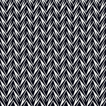 Ethnic seamless pattern. Freehand zigzag stripes print. Boho chic design background. Tribal style wallpaper. Brush wavy lines. Handdrawn geometric ornament. Chevron backdrop. Indigenous image.
