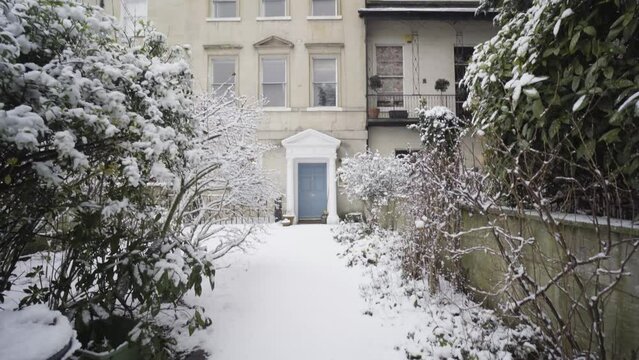 House street exterior during snowing season. Winter season snow day