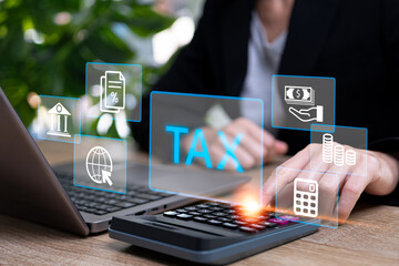 Government tax payment Individual income tax return concept, Businesswomen use calculator for Calculation tax payment financial statement of Business Accounting with tax icon on virtual screens