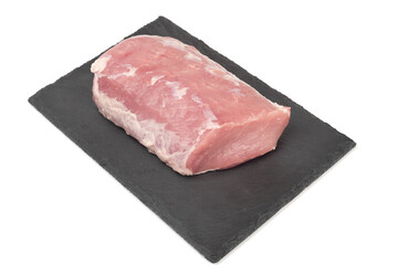 Fototapeta premium A piece of raw pork meat - carbonade on a mica serving board.