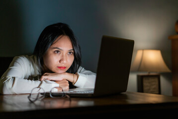 woman watching comedy video or film on netbook during free time on leisure