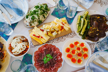 View from above. The table is served with a variety of snacks for the banquet. 