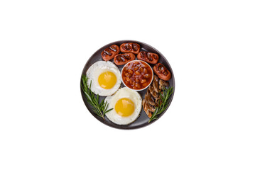 Full english breakfast with bean, fried eggs, roasted sausages, tomatoes and mushrooms