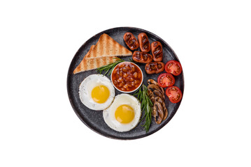 Full english breakfast with bean, fried eggs, roasted sausages, tomatoes and mushrooms