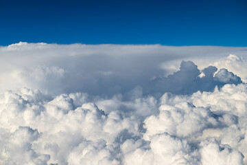 Beautiful Fluffy White and Gray Cumulonimbus Clouds on Blue Sky
