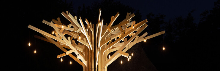 Rustic wooden garden tree decoration with string lights