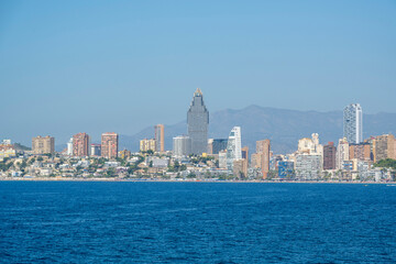Obraz premium Benidorm, Spain - August 19, 2023: Panoramic view of the Poniente beach in the city of Benidorm, Spain