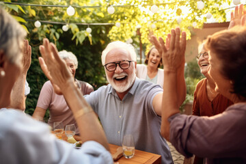 cheerful Senior People celebrating retirement. laughing and smiling happy mature group of people outdoors