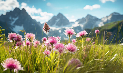 Vast alpine meadow dotted with vibrant wildflowers, with majestic snow-capped mountains in the backdrop. Created by AI tools