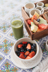 salad with berries and green smoothie green juice