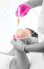 Doctor doing stem cell therapy on a patient's elbow after the injury. Treating knee pain with...