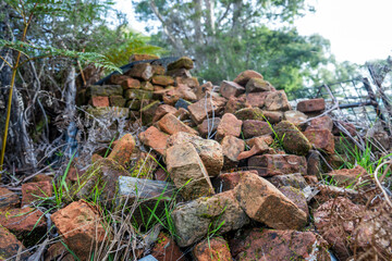 very old pile of red convict bricks for construction in tasmania australia
