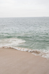 Fototapeta na wymiar waves and sand during high tide
