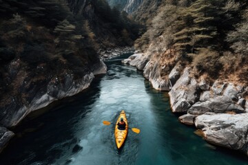 Top view boat of kayaker on mountain rough blue river, extreme sport kayak, aerial drone photo.