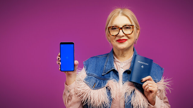 A Smiling Senior Tourist Is Holding An International Passport And A Phone, Easy Ticket Booking