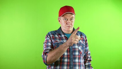 Old man in red baseball cap pointing at someone with finger and made inviting gesture.