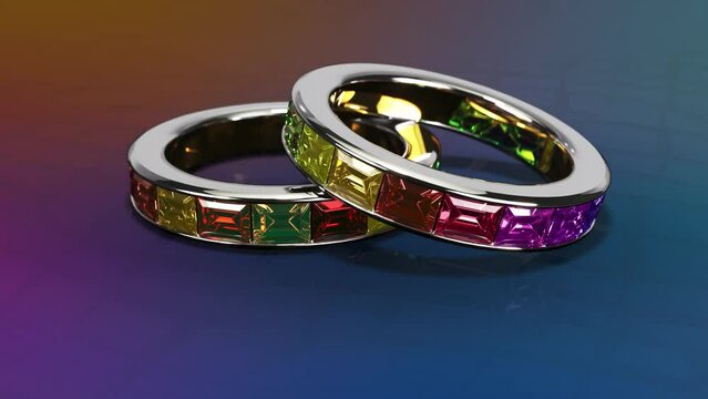 Two rings set with multicolored sapphires. 3d animation