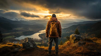 Deurstickers Majestic view: lone traveler stands at edge of rugged landscape.  © apratim