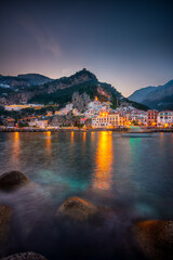 Sunset view of Amalfi cityscape on coast line Mediterranean sea, Italy