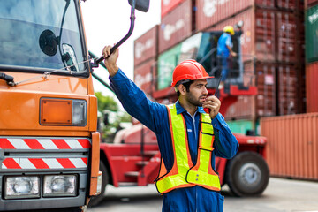 Foreman or worker work at Container cargo site check up goods in container. Foreman or worker checking on shipping containers. Logistics and shipping.