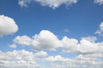Blue sky with puffy clouds