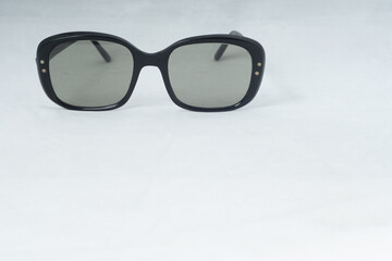 Retro Designer Fashion Sunglasses Black Frames On Natural Background Top Left