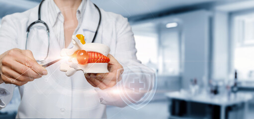 Doctor showing vertebral hernia on a virtual computer .