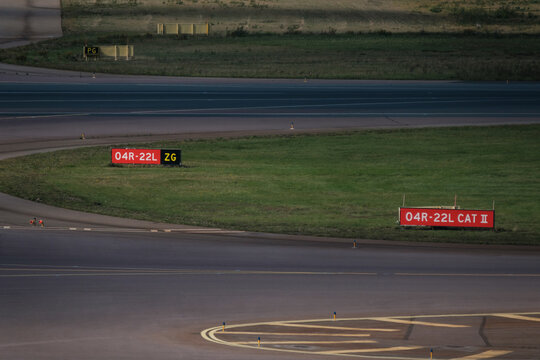 Airport apron, runway and taxiway. Airport tarmac signs.