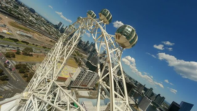 Ferris wheel in Melbourne FPV drone video. Amusement park.