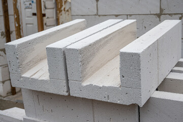 U Blocks of aerated concrete close-up, blocks for pouring concrete. Laying aerated concrete blocks....