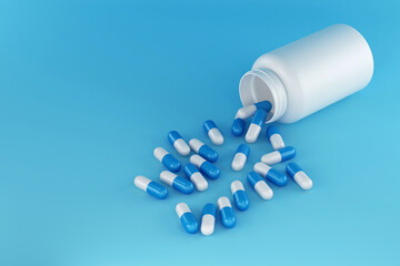 Pills capsules with bottle isolated on blue background