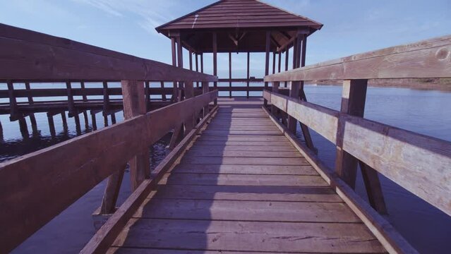 Wooden construction on the water with a beautiful lagoon panorama