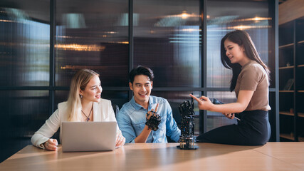 College Young students research inventions robotics and robot arm. Experiments and digital automation software.