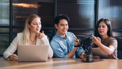 College Young students research inventions robotics and robot arm. Experiments and digital automation software.