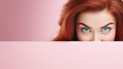 text space for advertising with funny part as portrait of irish female model with ginger hairs peeking over a colored panal