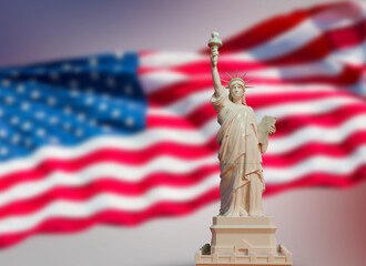 marble statue of liberty on USA flag