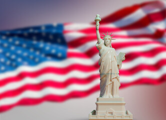 white statue of liberty on USA flag