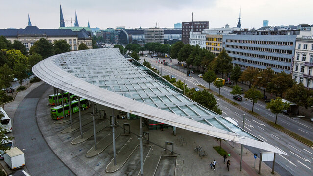 Panorama of Hamburg include curved roof of Bus Station of city and traffic and buses