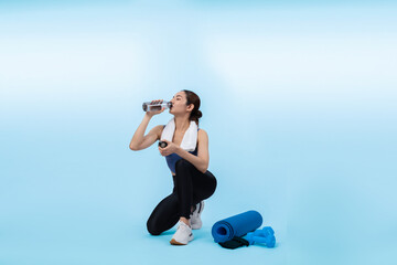 Athletic and sporty asian woman resting and drink water after intensive cardio workout training....