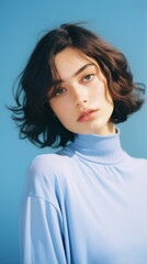 Fototapeta premium Beautiful girl on a blue background. The girl in blue. Generative AI