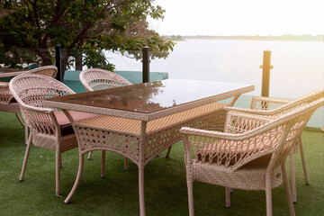 Wicker furniture, summer cafe outside. Tables and chairs. Restaurant