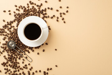 Coffee Morning Setup: Overhead shot of coffee beans, espresso cup on saucer, and barista's spoon on a soft beige backdrop with text space